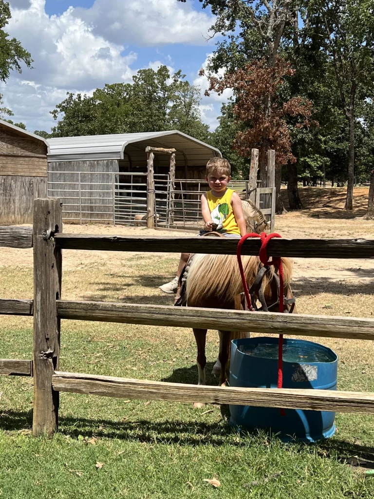 young-boy-horseback-riding-rockn-rowdy-ranch